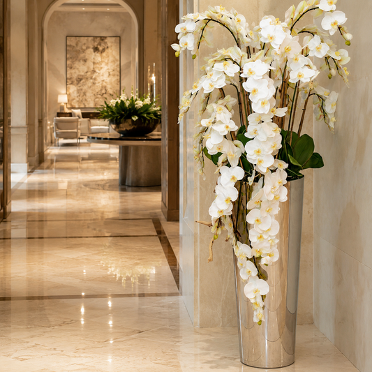 Cascading Phalaenopsis Orchids in Flared Polished Stainless Steel Cone for stylish interiors | Avenmoss